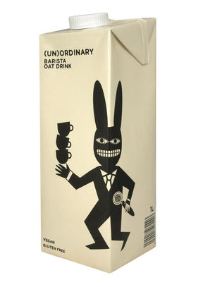 (Un)Ordinary Barista Oat Drink 1L carton with a black cartoon rabbit mascot in a suit, holding cups.